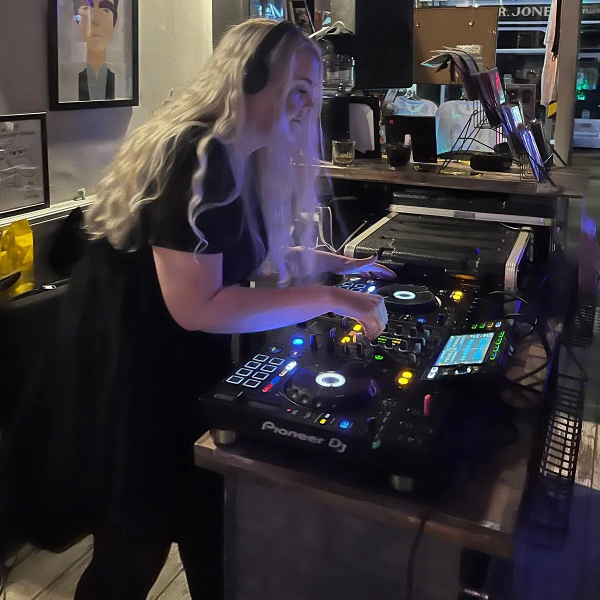 A Proper Sound DJ performing behind the decks